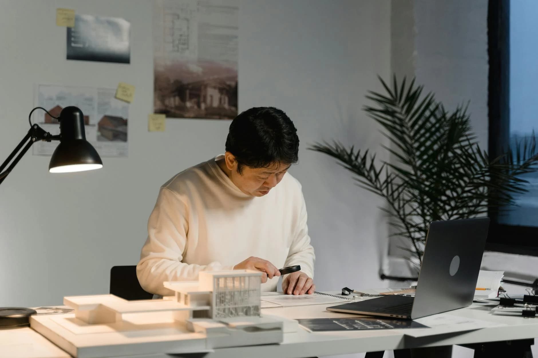 Professional reviewing long-term eligibility documents at calm desk