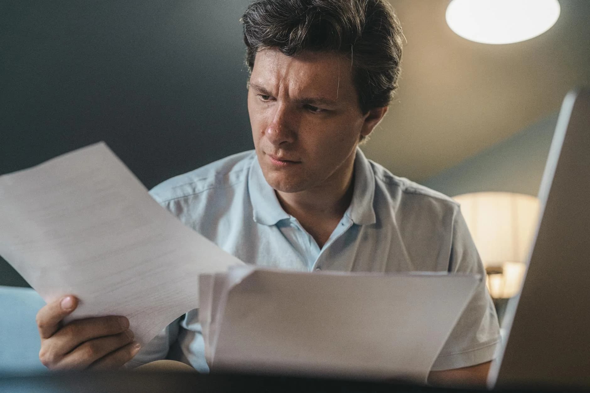 Person reading structured FAQ at calm desk representing future strategy questions
